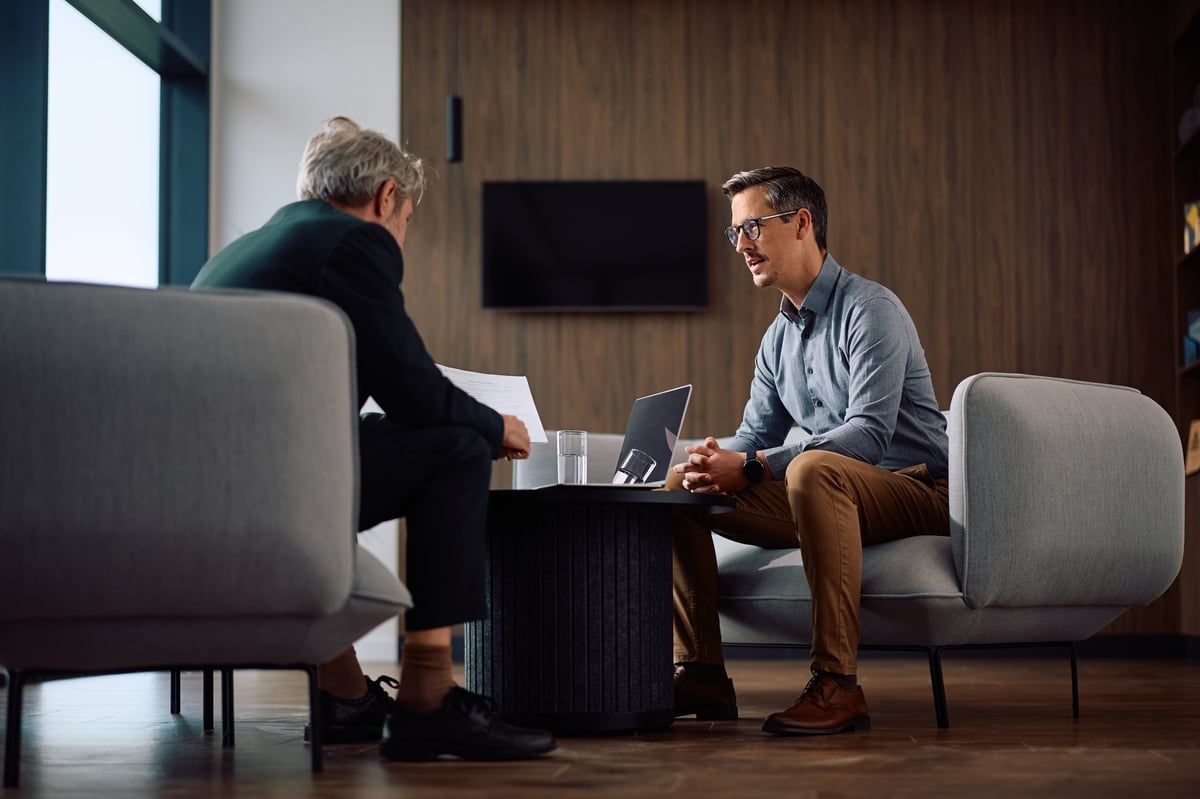 Two business owners reviewing growth reports together